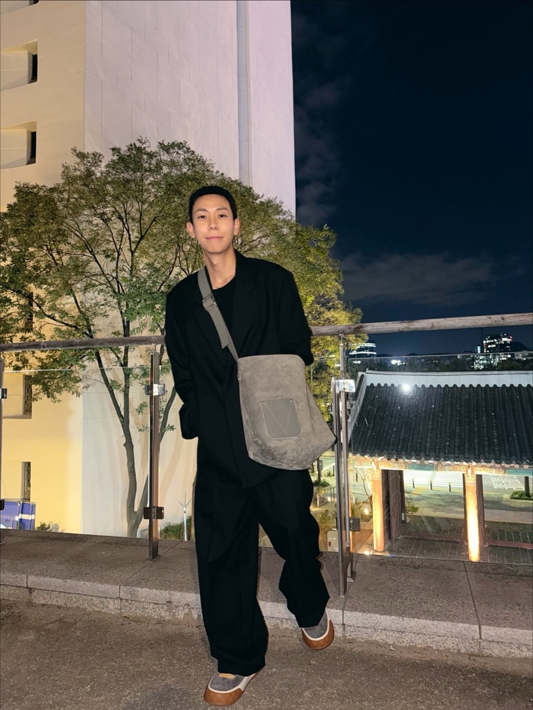 Photo shared by Loco | 로꼬 on November 04, 2025 tagging @louisvuitton. May be an image of sling, sweatpants and text.