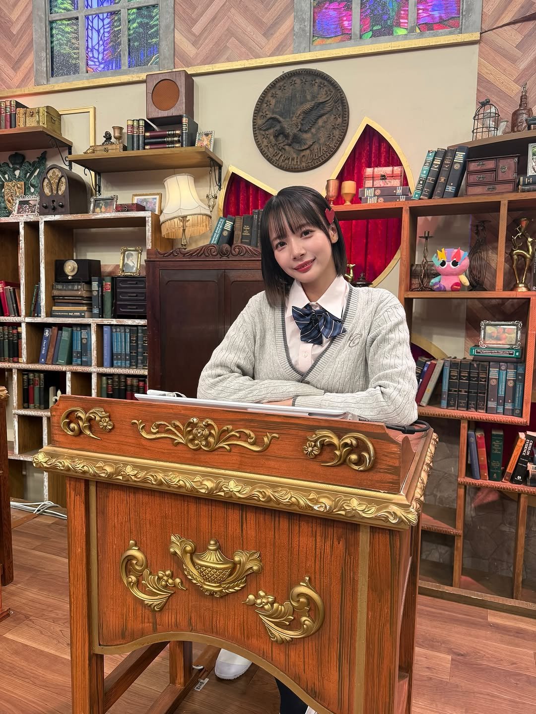 Photo by 岡田紗佳 on November 15, 2025. May be an image of duffle coat, book and text.