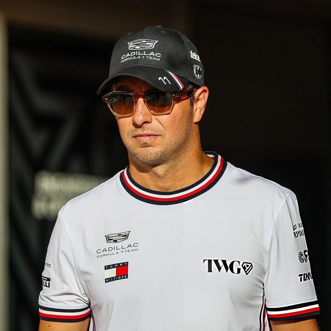 Photo by Checo Pérez on February 20, 2026. May be an image of racing vehicles, glasses, helmet and text.