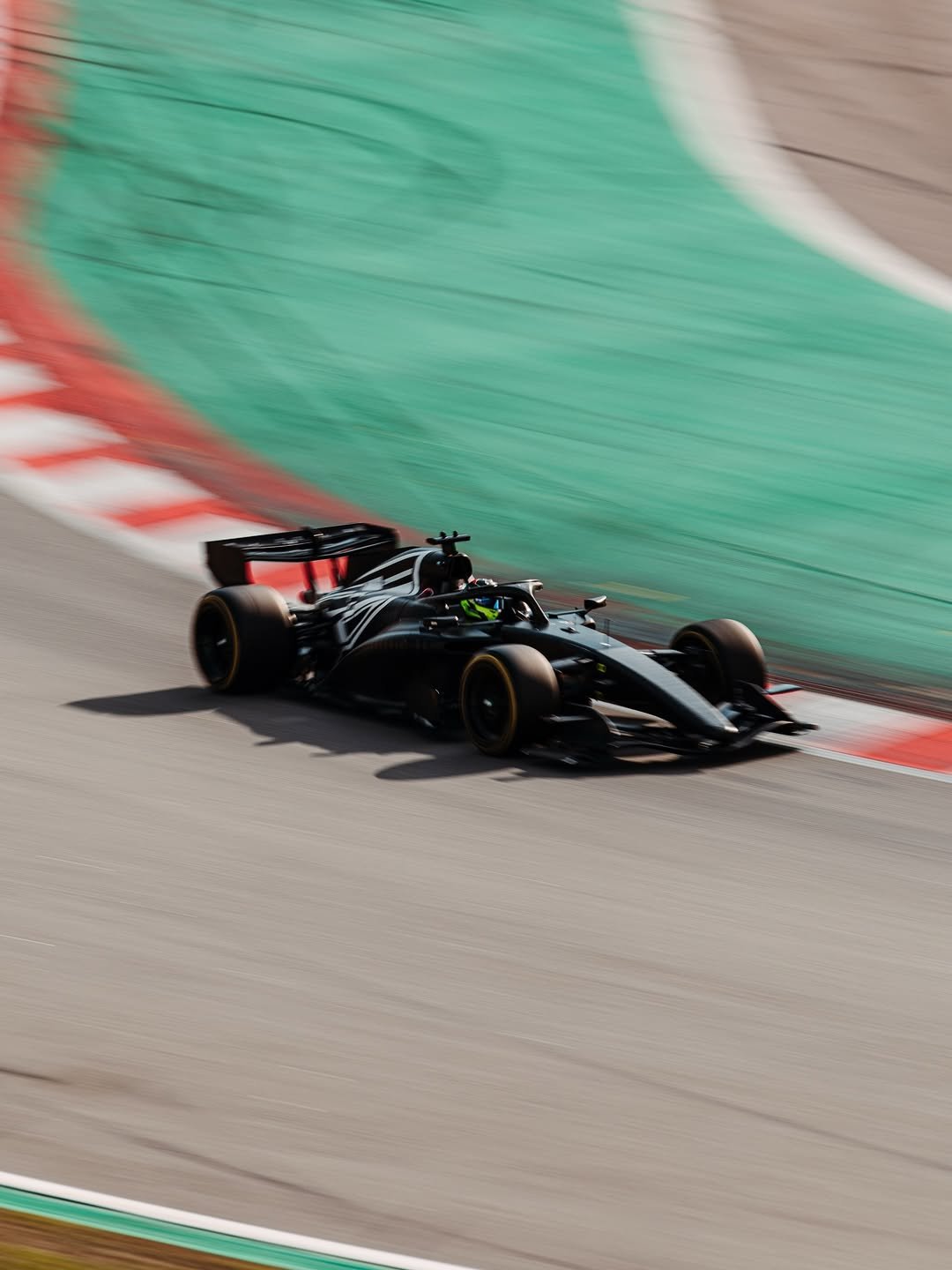 Photo shared by Checo Pérez on January 29, 2026 tagging @cadillacf1. May be an image of racing vehicles, race car and text.