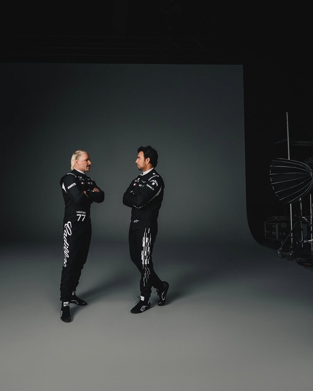 Photo shared by Cadillac Formula 1 Team on January 28, 2026 tagging @schecoperez, and @valtteribottas. May be an image of military uniform and text.