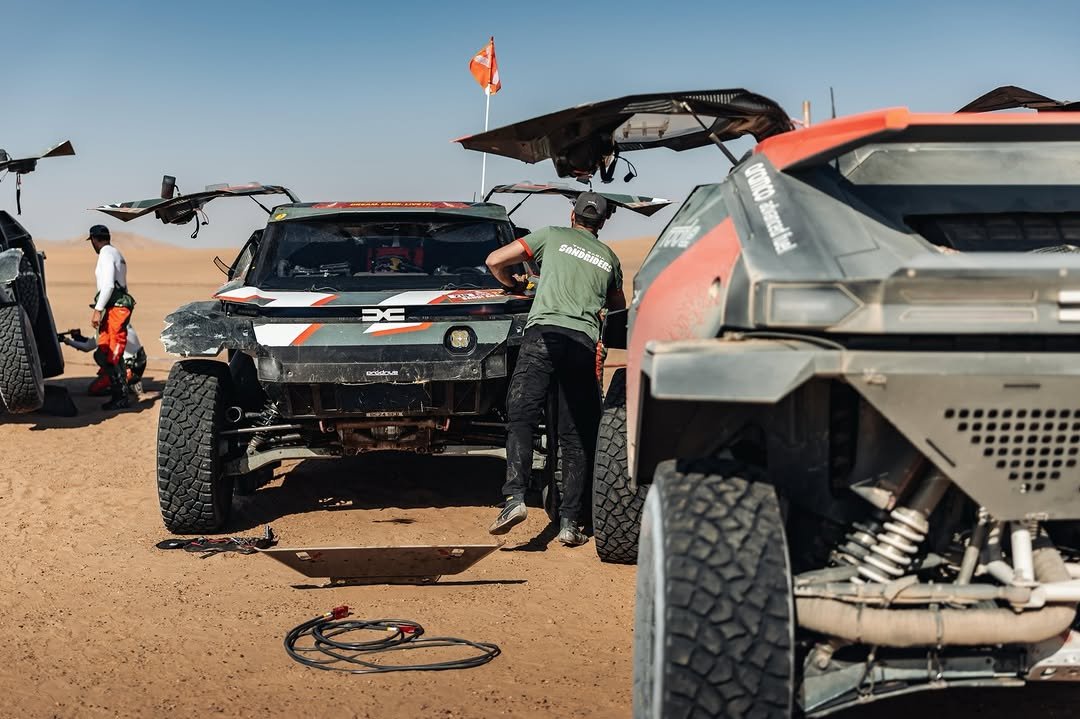 Photo shared by Sébastien Loeb on January 14, 2026 tagging @cris_tortu, @redbulldesertwings, @bfgoodricheurope, @pablomorenohuete, and @the_dacia_sandriders. May be an image of racing vehicles, all-terain vehicle, buggy, dune buggy, wheel, race car and text.