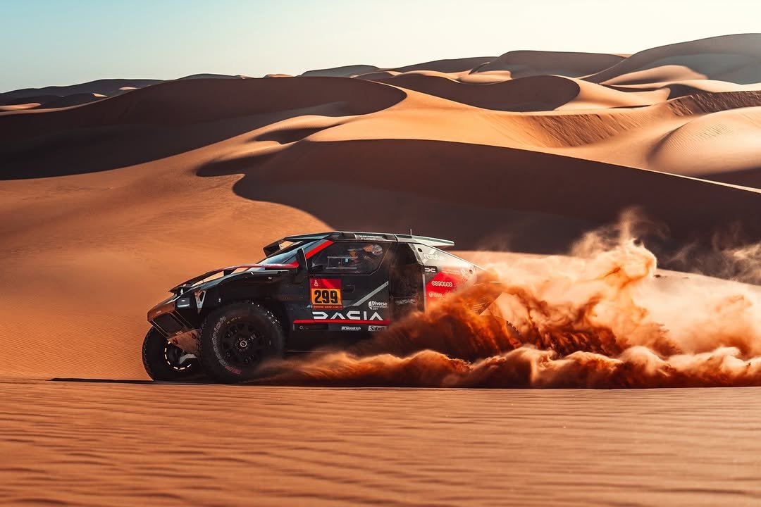 Photo shared by The Dacia Sandriders on April 02, 2026 tagging @desafioruta40, @nasser_dakar, @fabianlurquin, and @officialw2rc. May be an image of racing vehicles, race car, dune buggy, buggy, wheel and text.