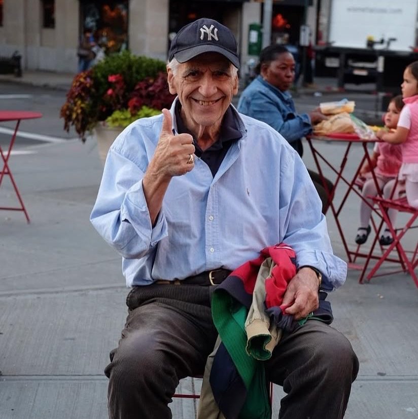 Photo shared by seesawboard | 취향 보관함 on July 12, 2025 tagging @yankees. May be an image of 2 people, people smoking, people standing, newspaper, street, curb and text.