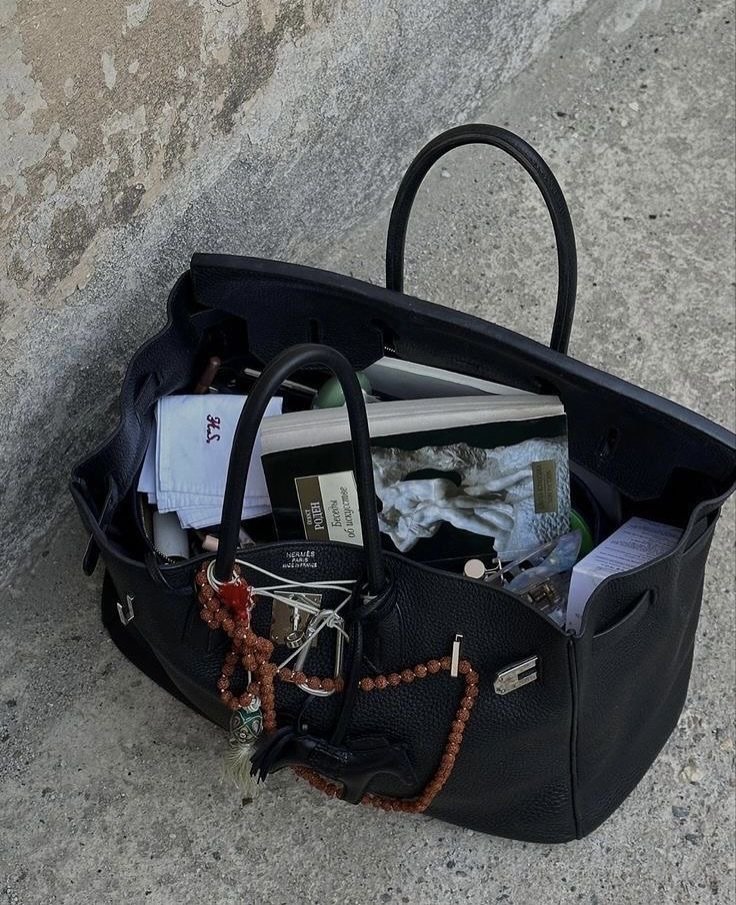 Photo shared by seesawboard | 취향 보관함 on July 09, 2025 tagging @hermes. May be an image of tool bag, purse, garbage, luggage, grocery bag, plastic bag, briefcase and text.