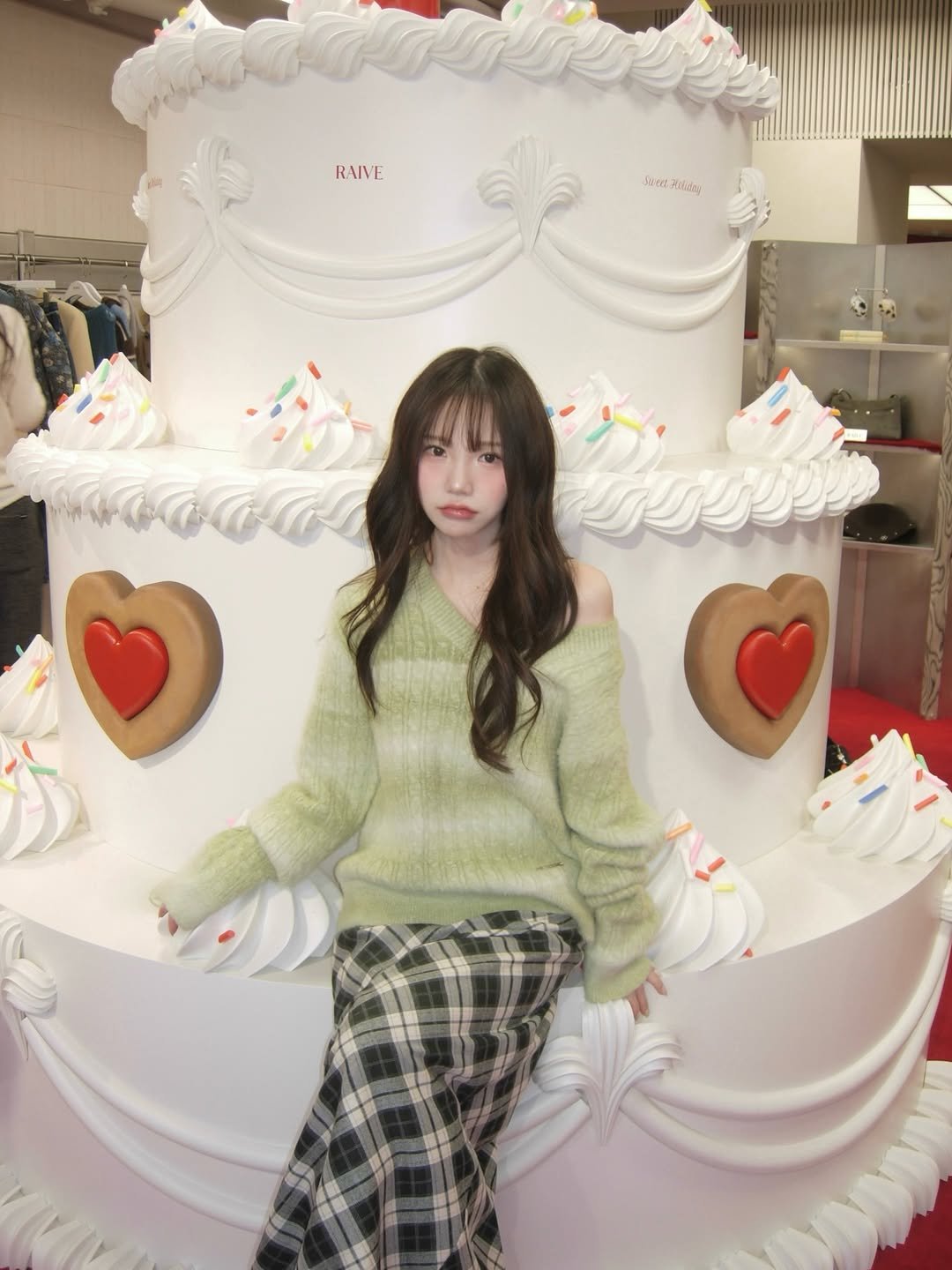 Photo shared by 세니 on December 02, 2025 tagging @raive_studio. May be an image of duffle coat, sweater and text.