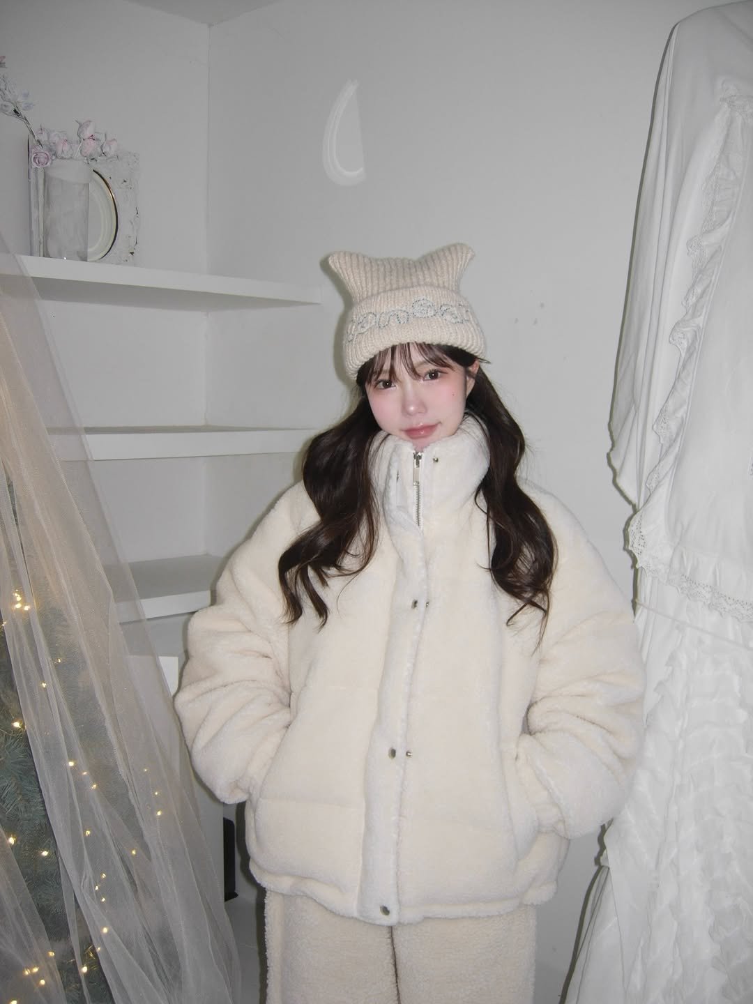 Photo shared by 세니 on December 06, 2025 tagging @archive.jtou. May be an image of goosedown coat, duffle coat, sable coat, hat, parka, fleece and text.