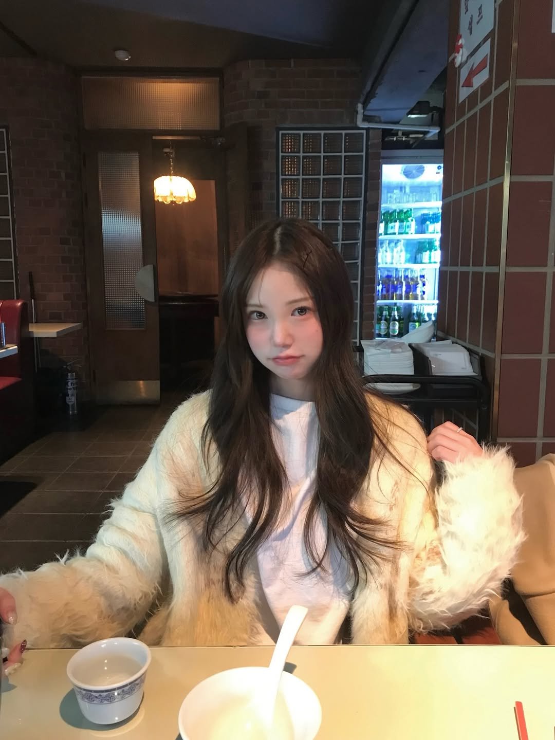 Photo by 세니 on December 26, 2025. May be an image of one or more people, hair, duffle coat, parka and text.