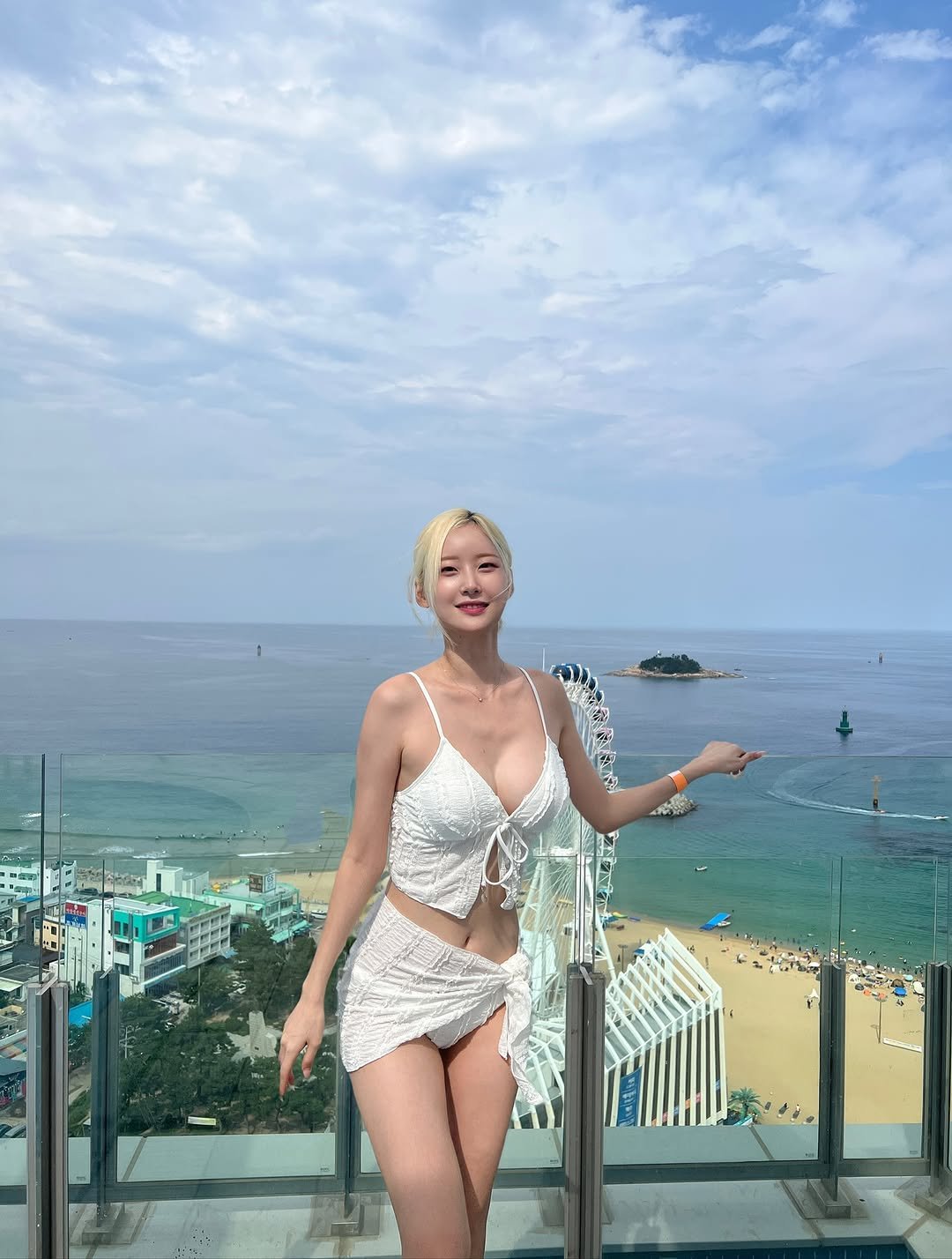 Photo by 서현숙 on August 30, 2025. May be an image of 1 person, hair, sarong, bra, outdoors and text.