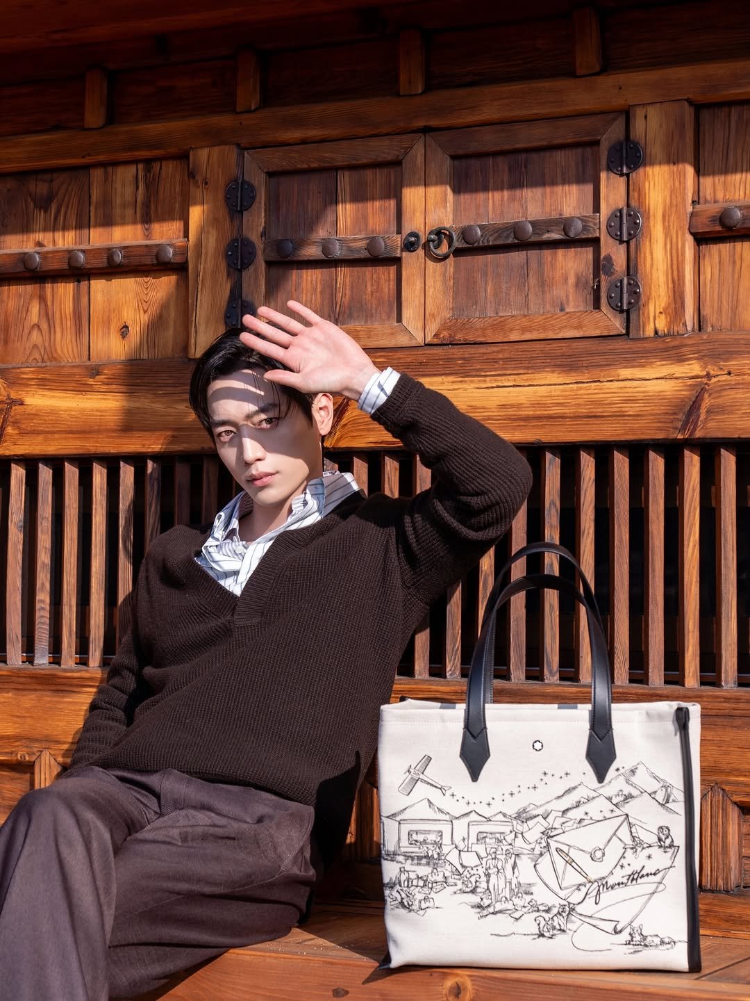 Photo shared by 서강준 on December 07, 2025 tagging @montblanc. May be an image of leather, purse, briefcase and text.