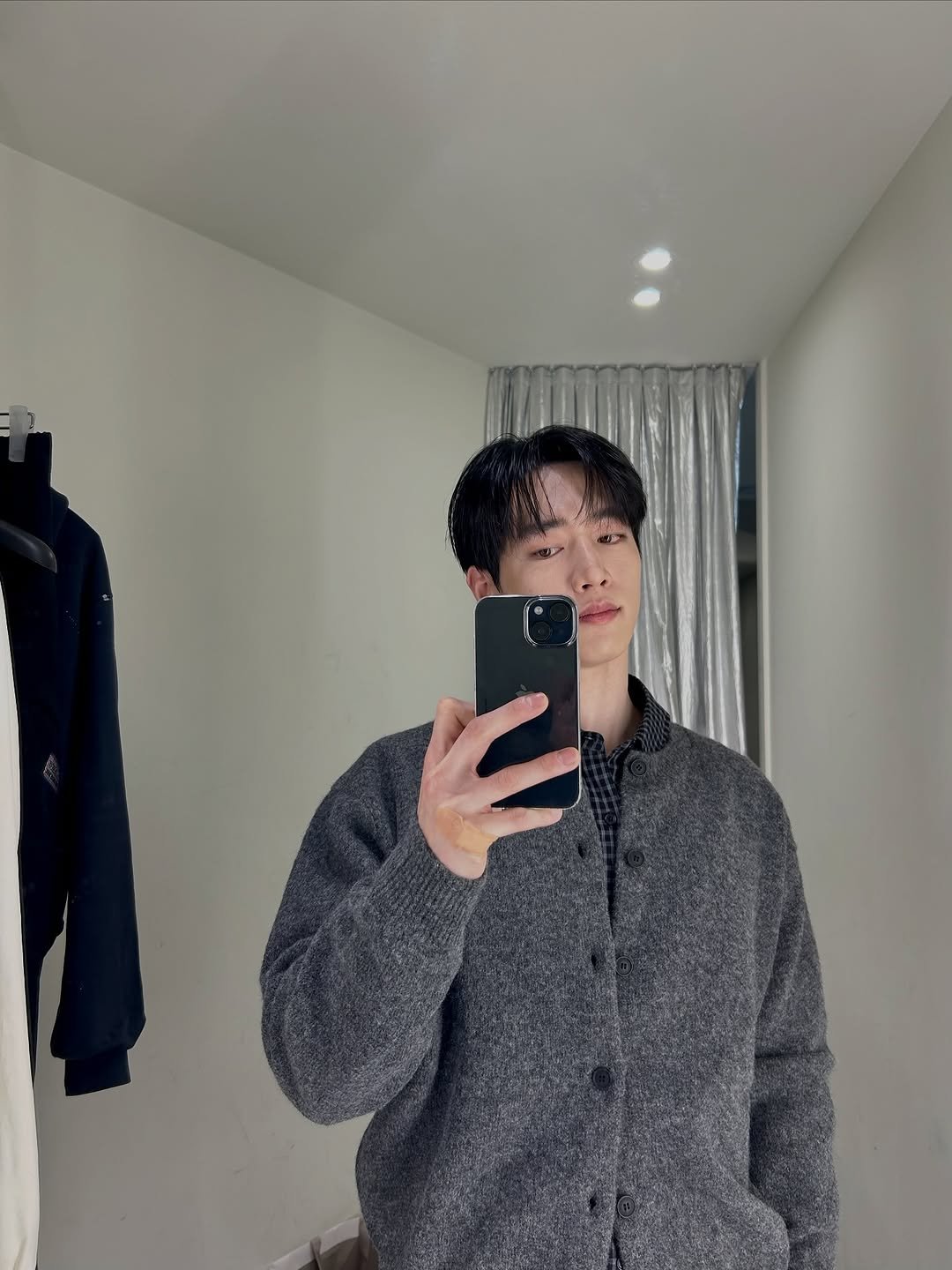 Photo by 서강준 on October 26, 2025. May be a selfie of one or more people, hair, duffle coat, mirror, sweater and text.