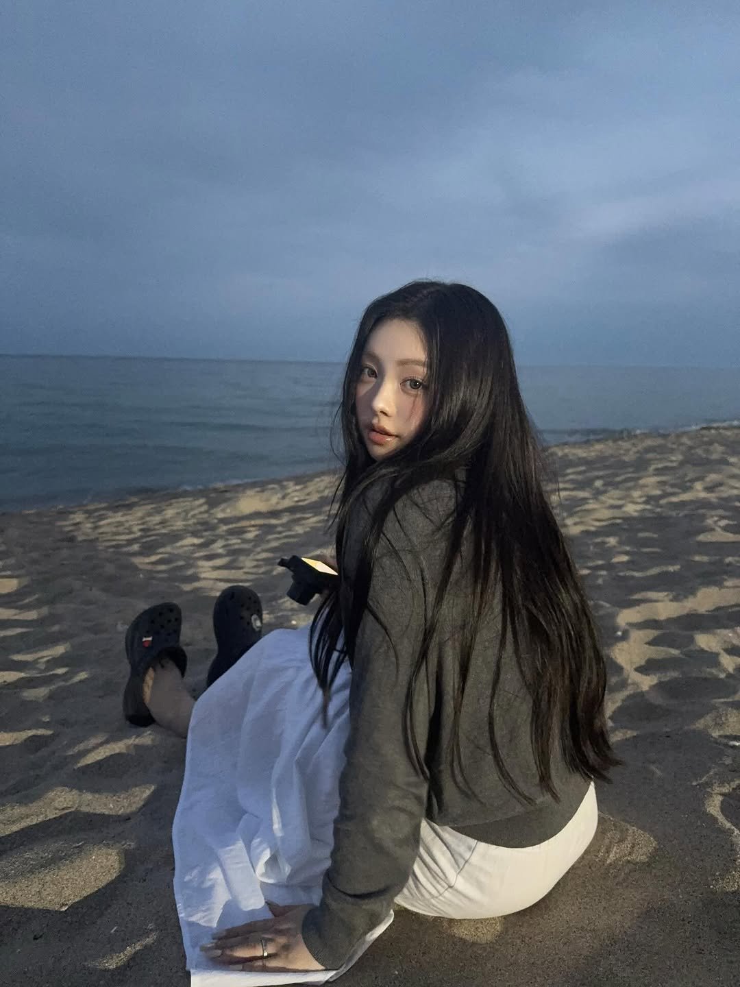 Photo by 김선우 on September 09, 2025. May be an image of 1 person, long hair, beach, ocean and text.