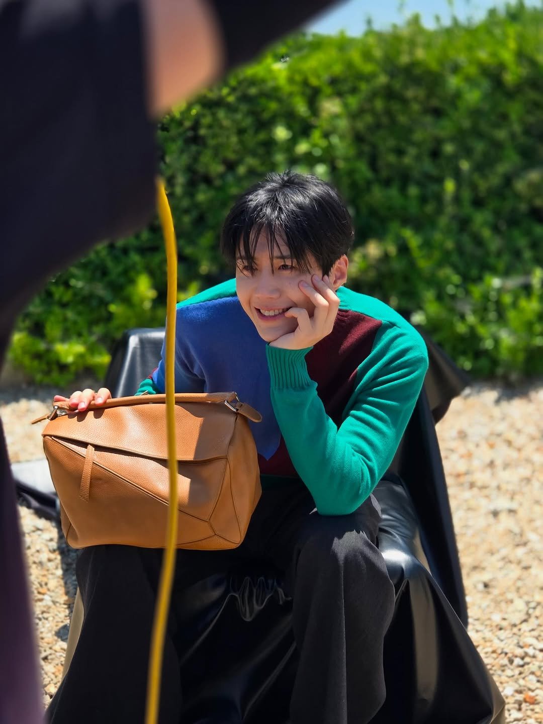 Photo shared by 김선호 on August 07, 2025 tagging @loewe, and @ellekorea. May be an image of 1 person, child and text.