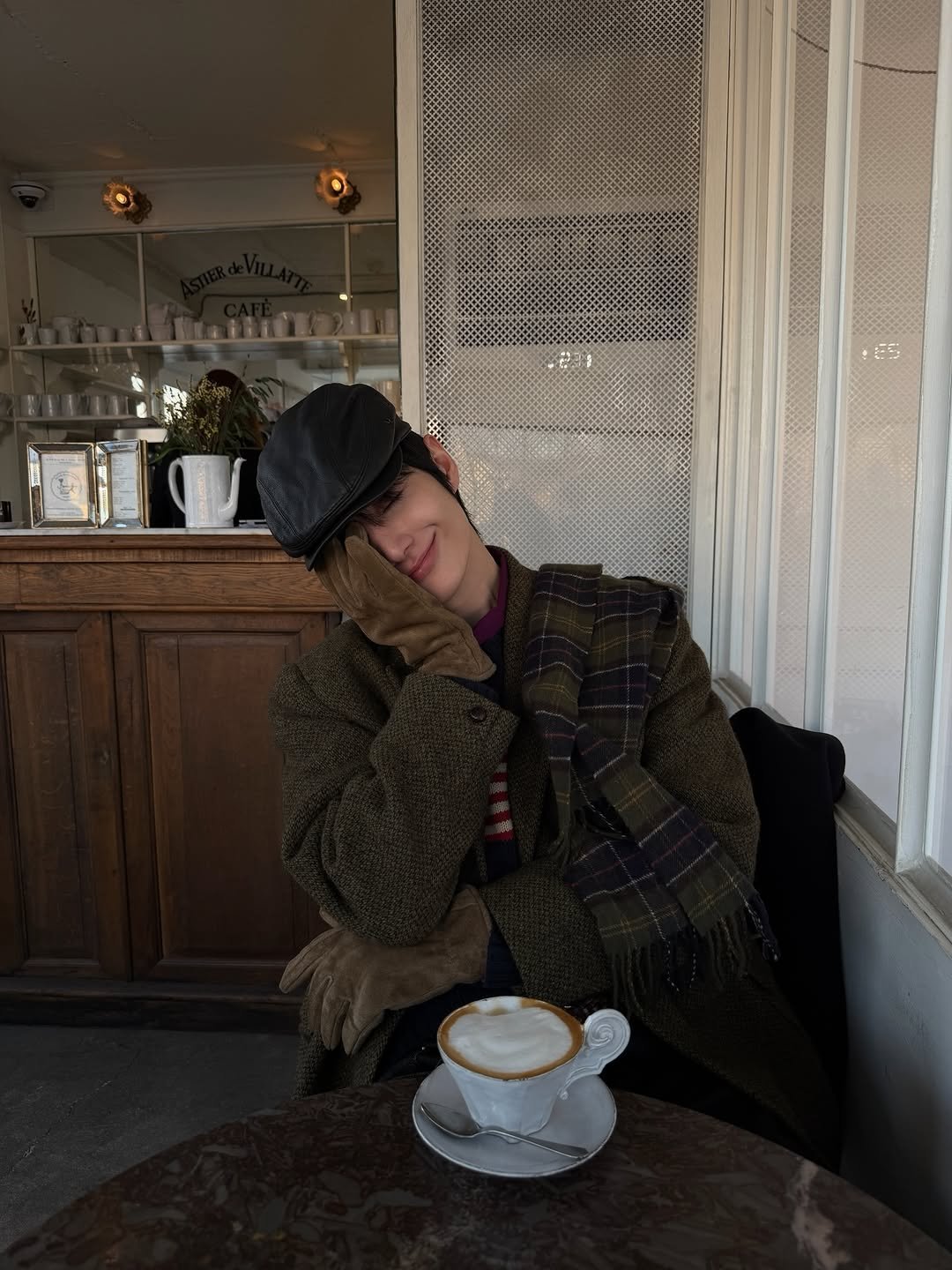 Photo by 정선혁 Seon Hyeok on December 25, 2025. May be an image of duffle coat, overcoat, coffee cup, hat, beret, bowler hat and text.