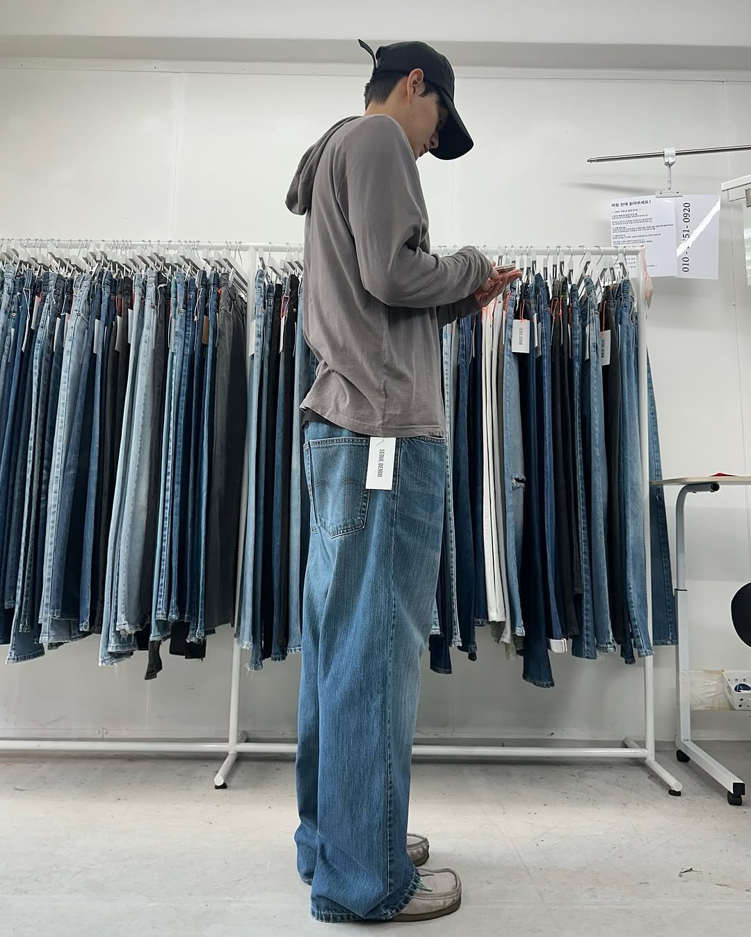 Photo shared by 서울데님 on November 05, 2025 tagging @seoul__denim. May be an image of rack and text.