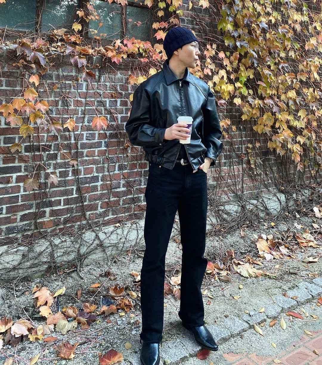 Photo shared by 서울데님 on November 03, 2025 tagging @seoul__denim. May be an image of wingtip shoes, overcoat, beret, brick wall and text.