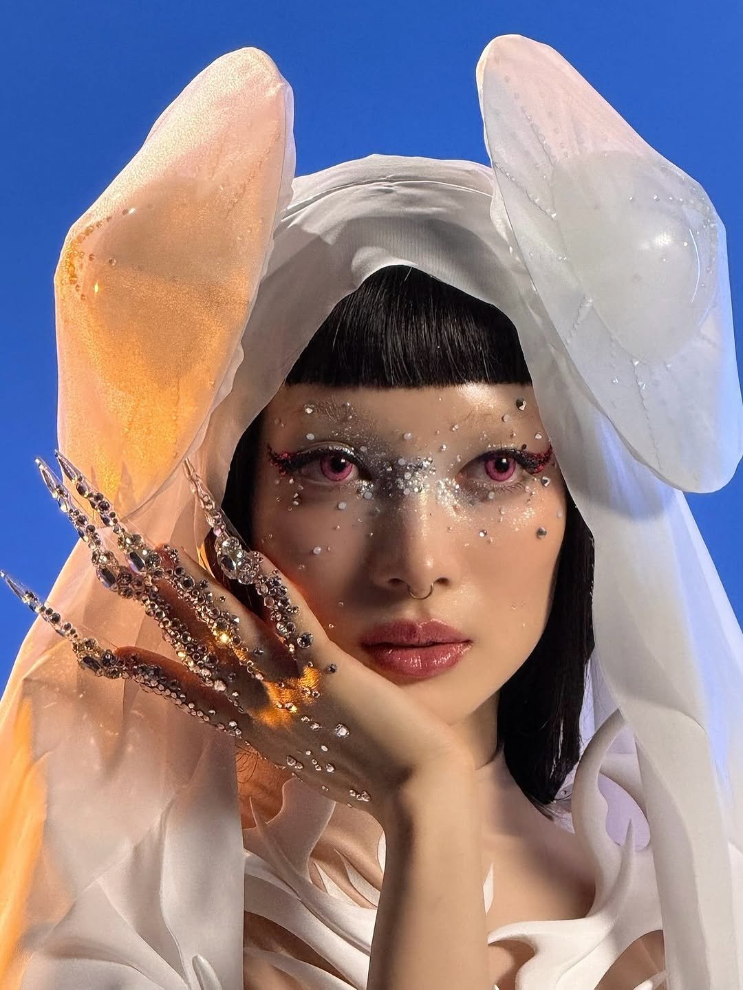 Photo shared by 김서울 Seoul Kim on September 26, 2025 tagging @xgofficial. May be an image of 1 person, makeup, headdress, costume and text.