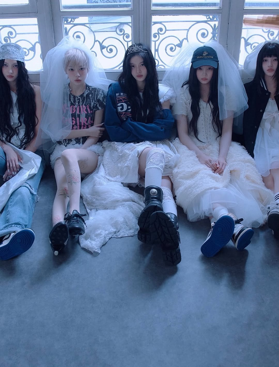 Photo shared by Seoul Kim on April 24, 2026 tagging @illit_official. May be an image of one or more people, hair, makeup, headdress and text.