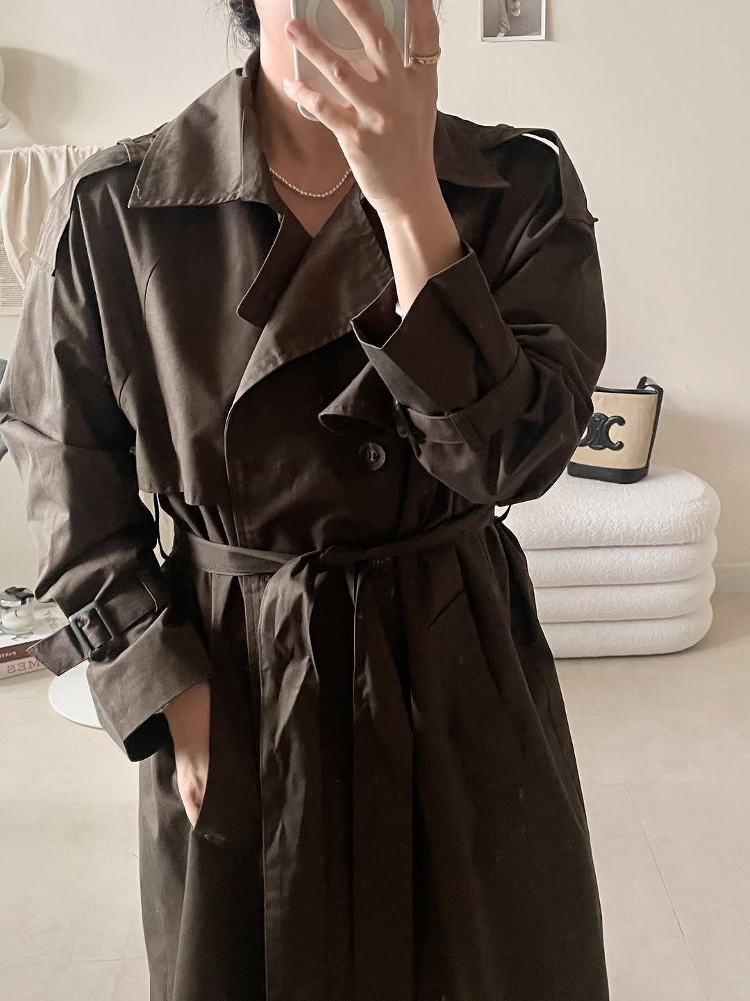 Photo by sera jung on September 09, 2025. May be an image of 1 person, duffle coat, overcoat, jacket, raincoat, parka and text.
