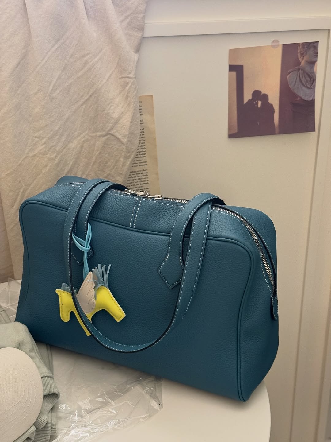 Photo by sera jung on November 02, 2025. May be an image of purse, briefcase, clutch and text.