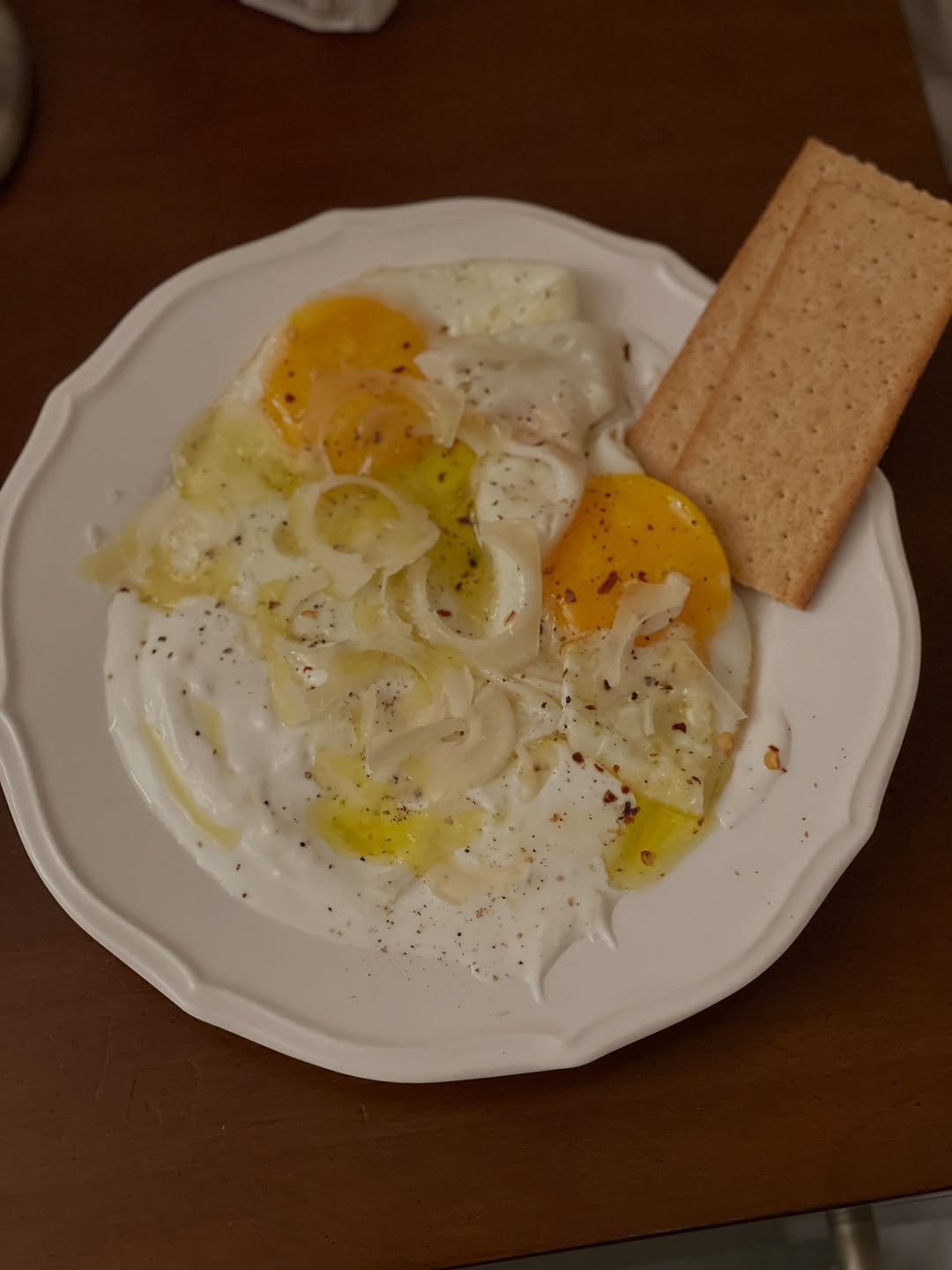 Photo by sera jung on October 14, 2025. May be an image of poached egg, egg yolk, crackers and text.