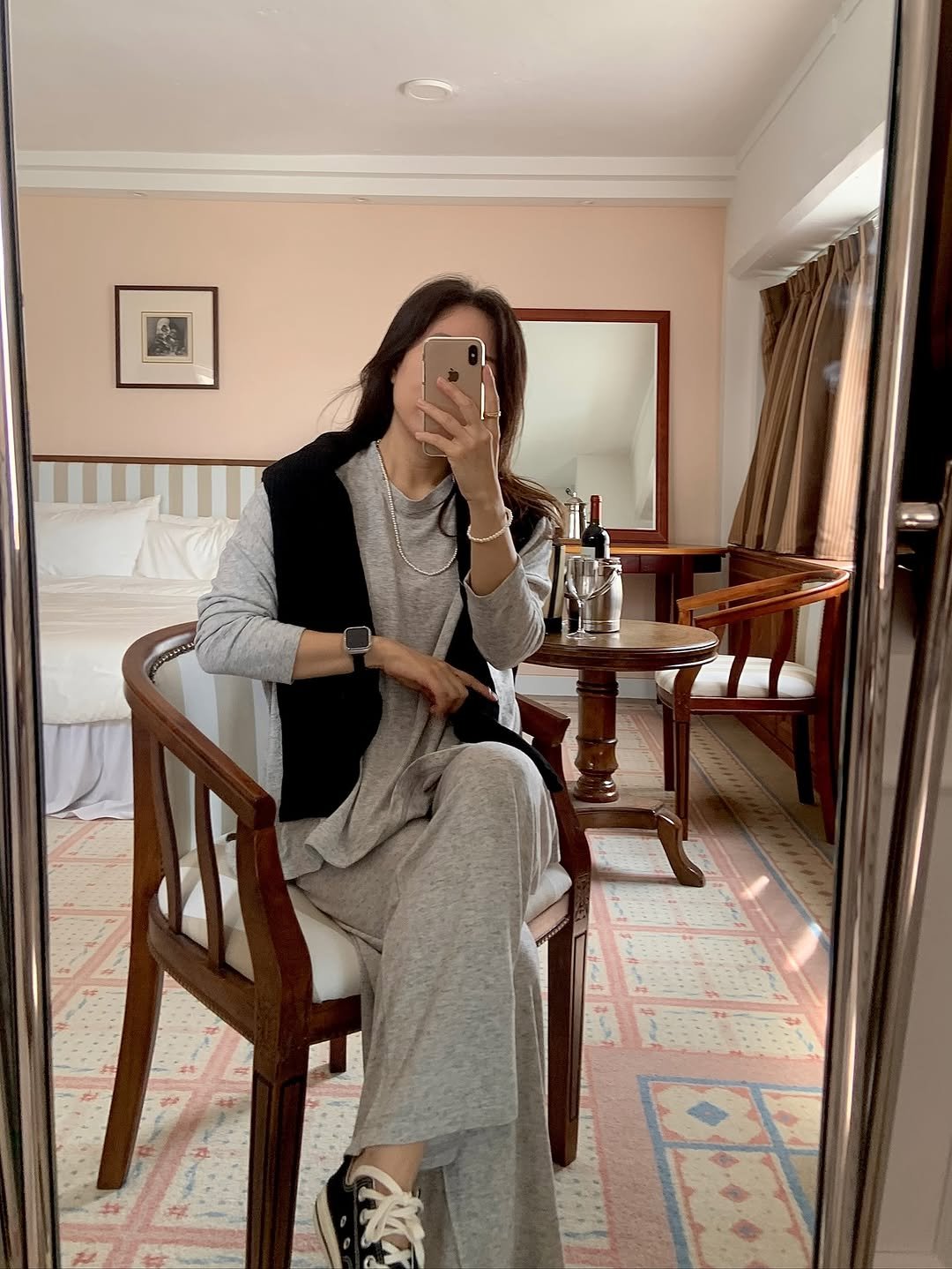 Photo by sera jung on October 11, 2025. May be an image of sleepwear, sweatpants, armoire, bath robe and text.