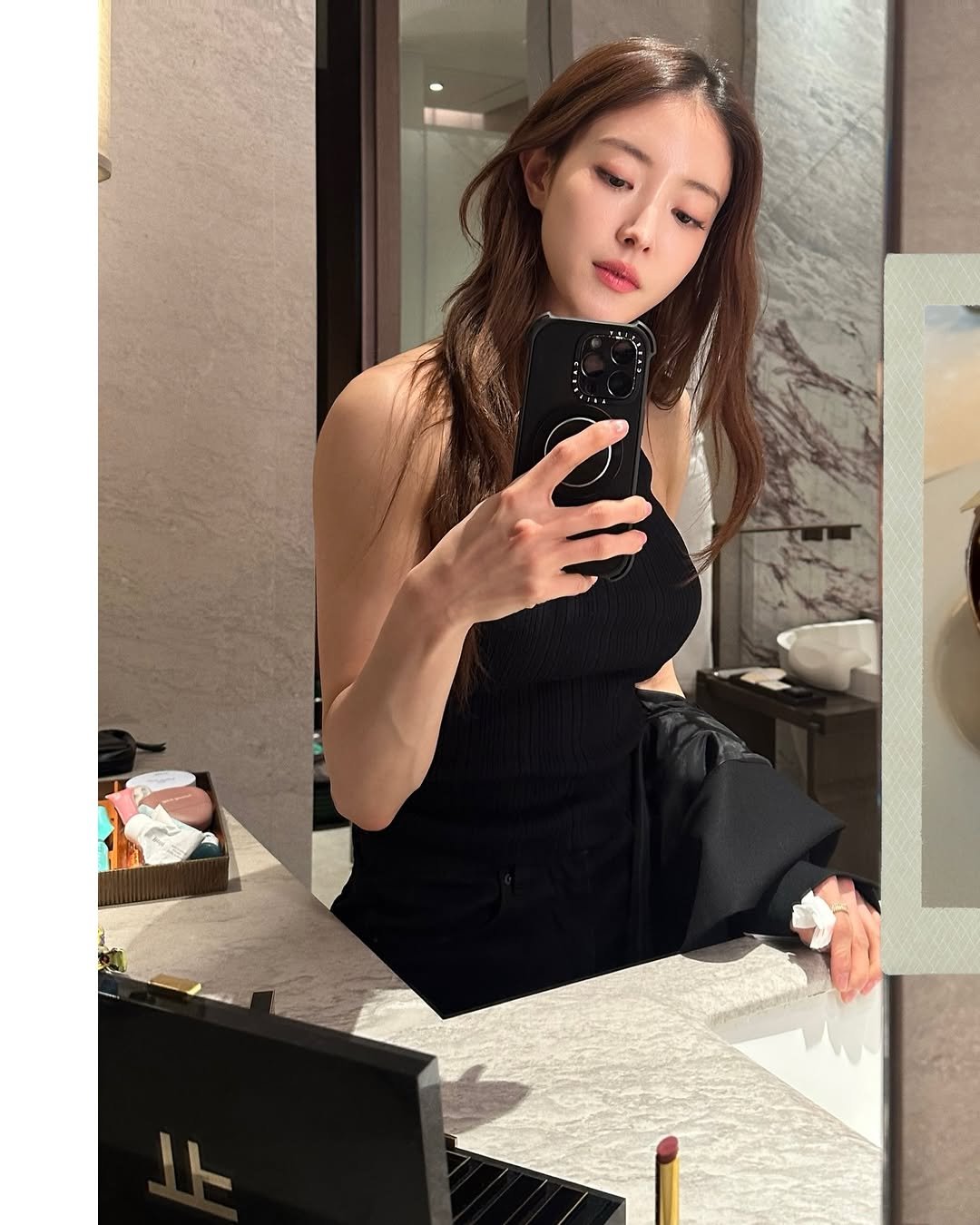 Photo shared by Seyoung Lee on January 21, 2026 tagging @tomfordbeauty. May be an image of one or more people, hair, mirror, top and text.