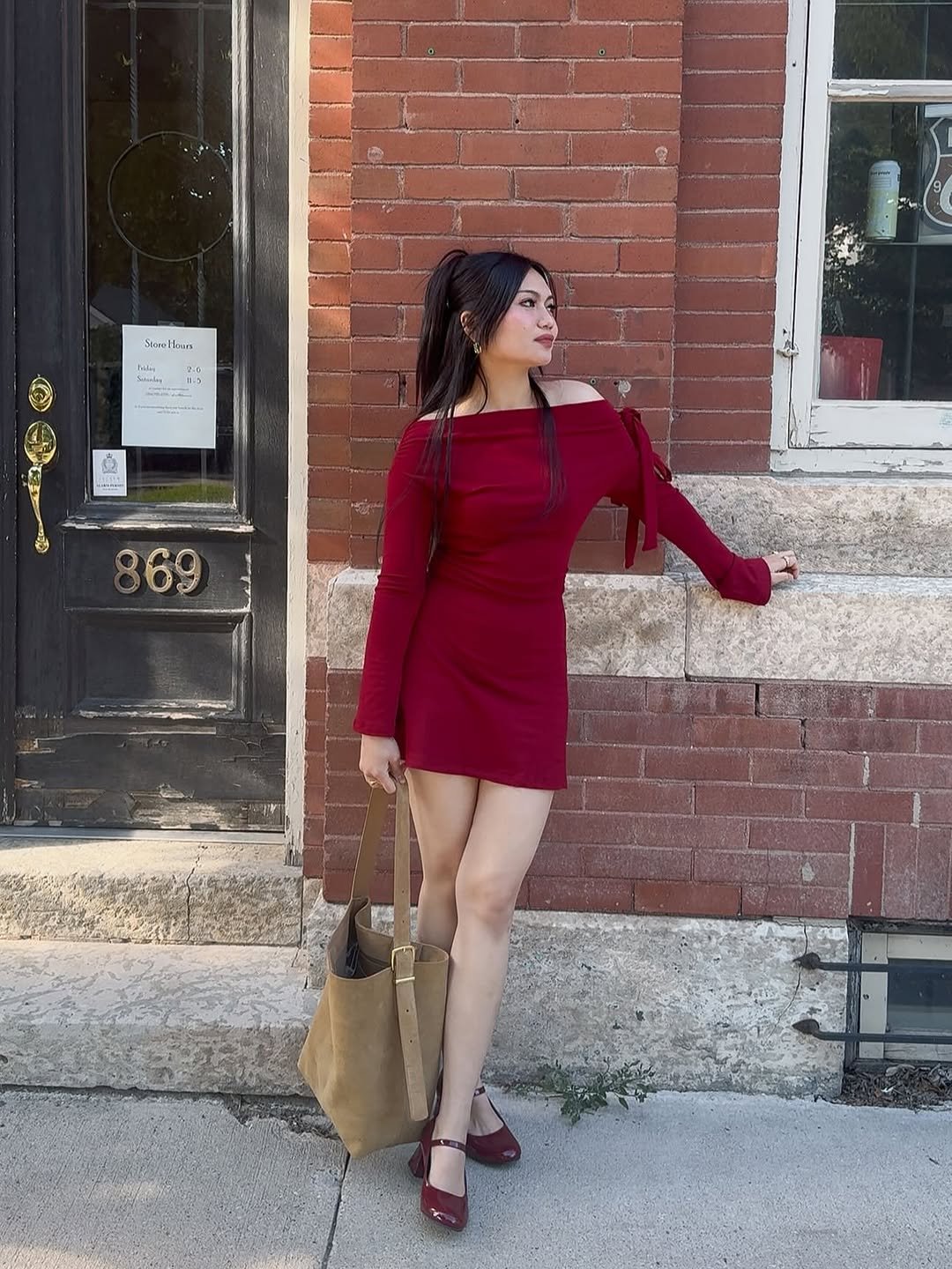 Photo by Shayne Hydn on August 25, 2025. May be an image of 1 person, dress, brick wall and text.