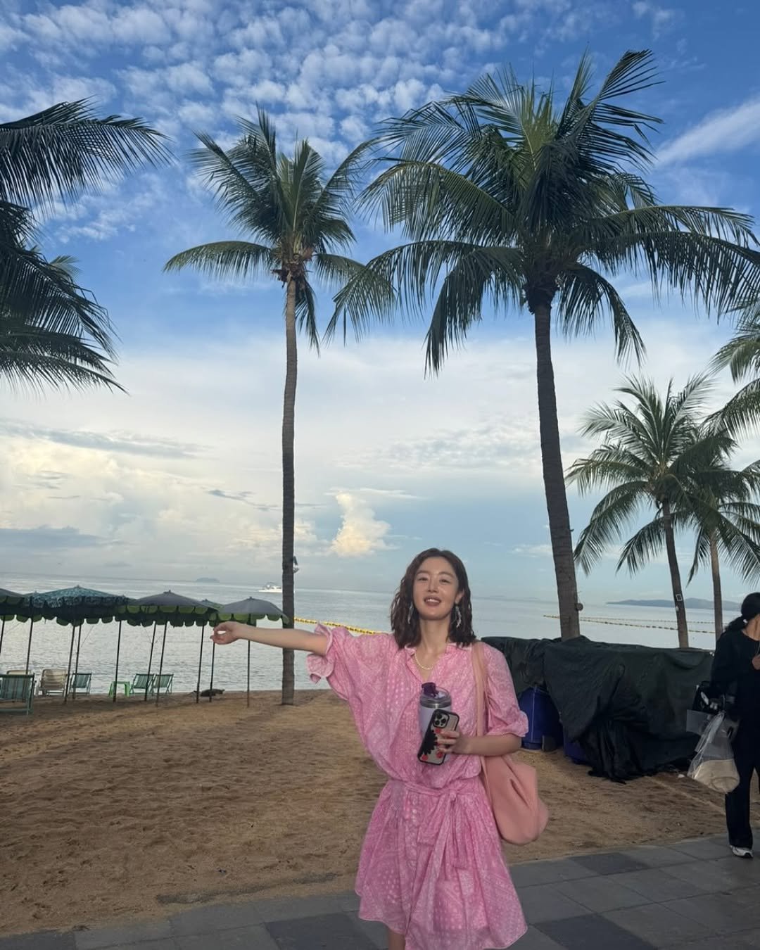 Photo by shh daily on October 26, 2025. May be an image of sundress, sarong, cloud, palm trees and text.