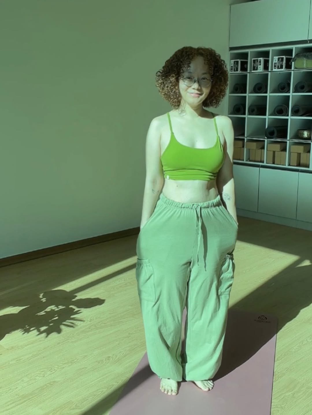 Photo shared by 김신혜 on January 22, 2026 tagging @official.dhyani. May be an image of yoga, activewear, sweatpants and text.