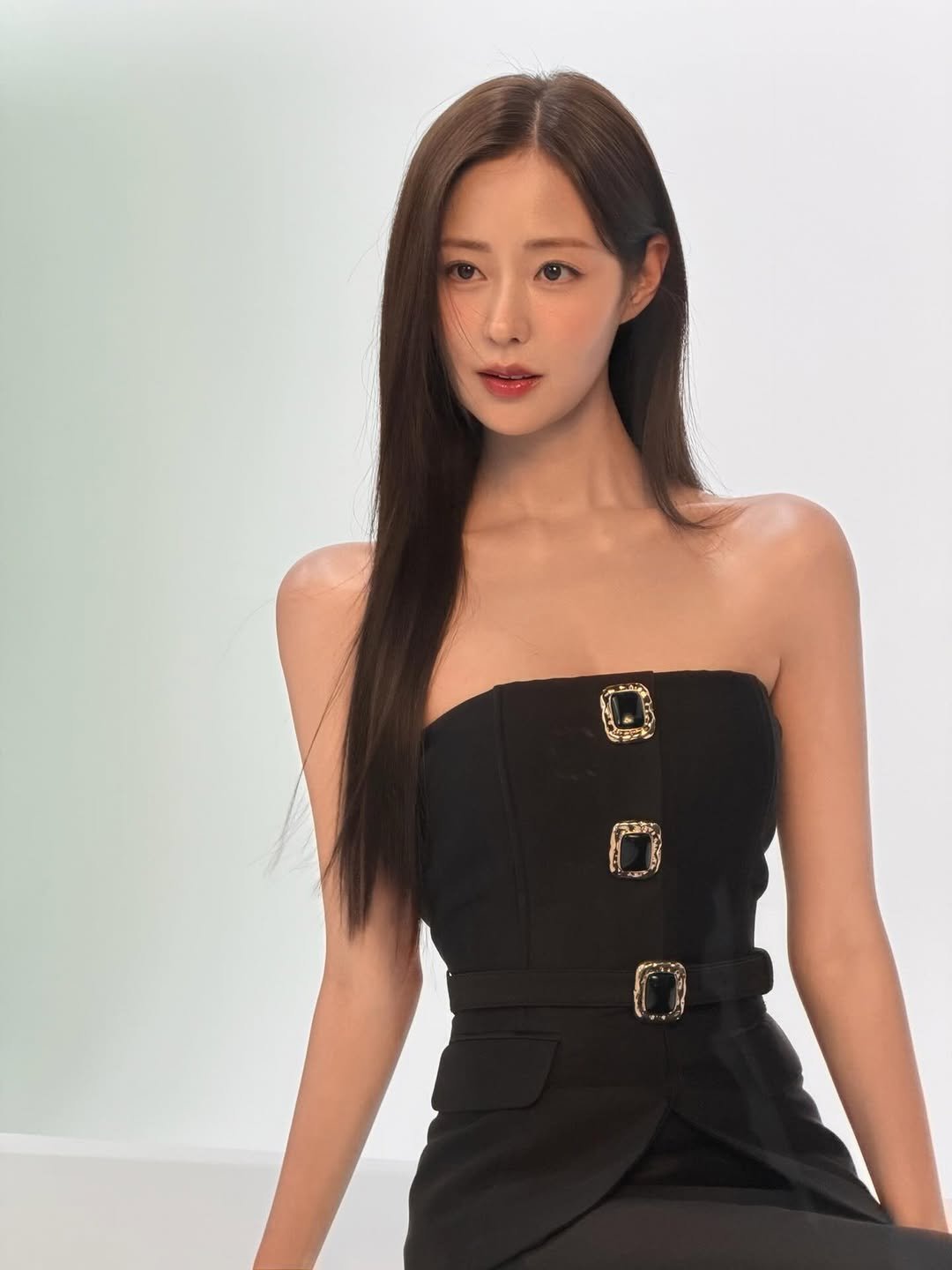 Photo shared by 신슬기 Shin Seul Ki on March 04, 2026 tagging @mirajet_official. May be an image of one or more people, hair, halter top, dress and text.