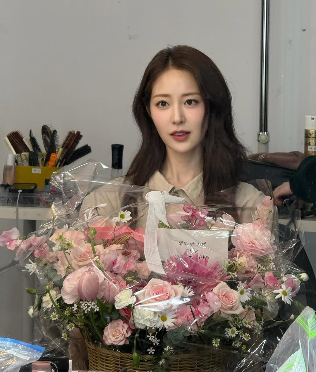 Photo shared by 신슬기 Shin Seul Ki on March 13, 2026 tagging @ifne_official. May be an image of one or more people, hair and text.