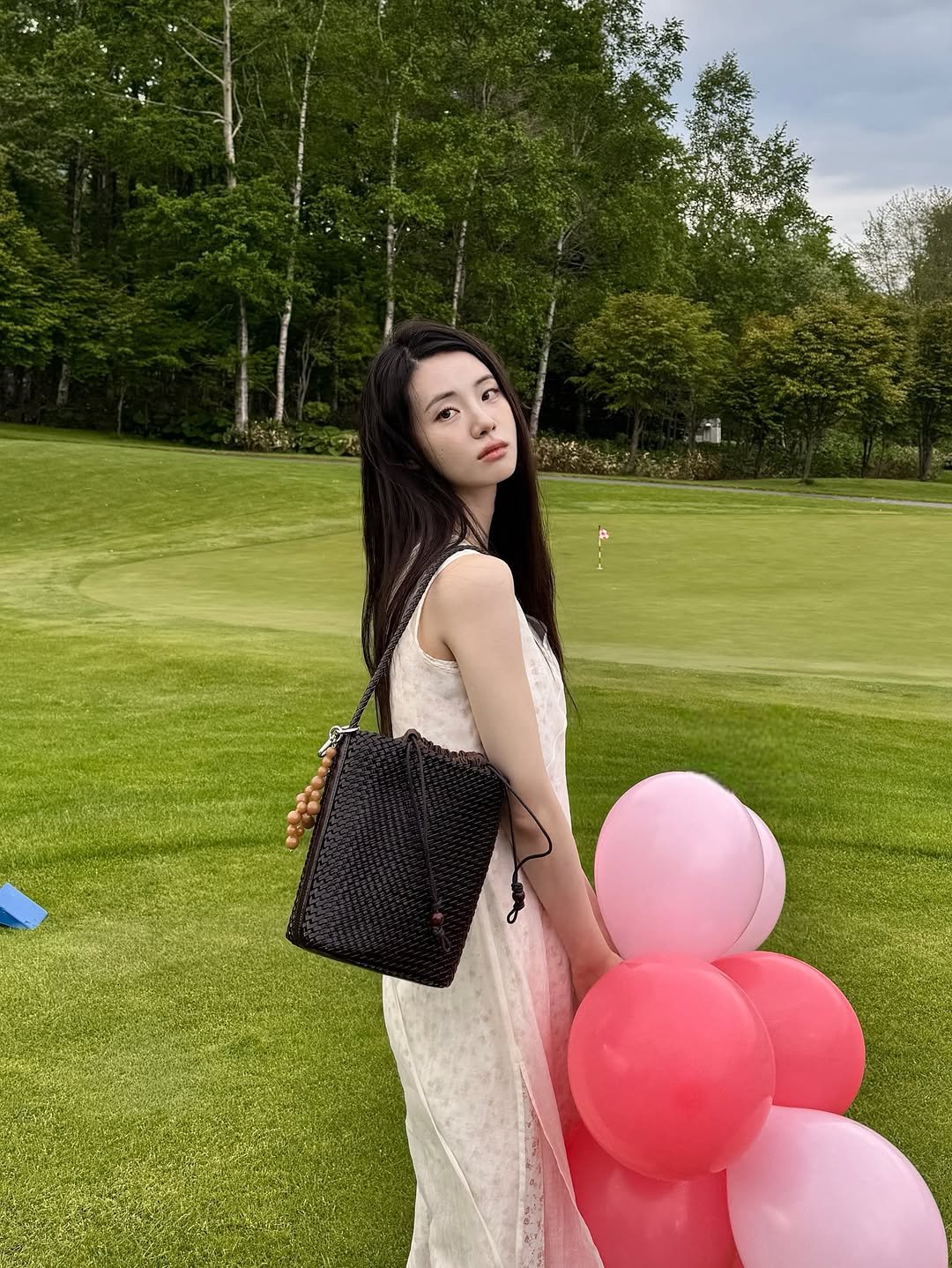 Photo shared by 신시아 on June 16, 2025 tagging @maisonloeuvre. May be an image of dress, sundress, balloon, outdoors and text.