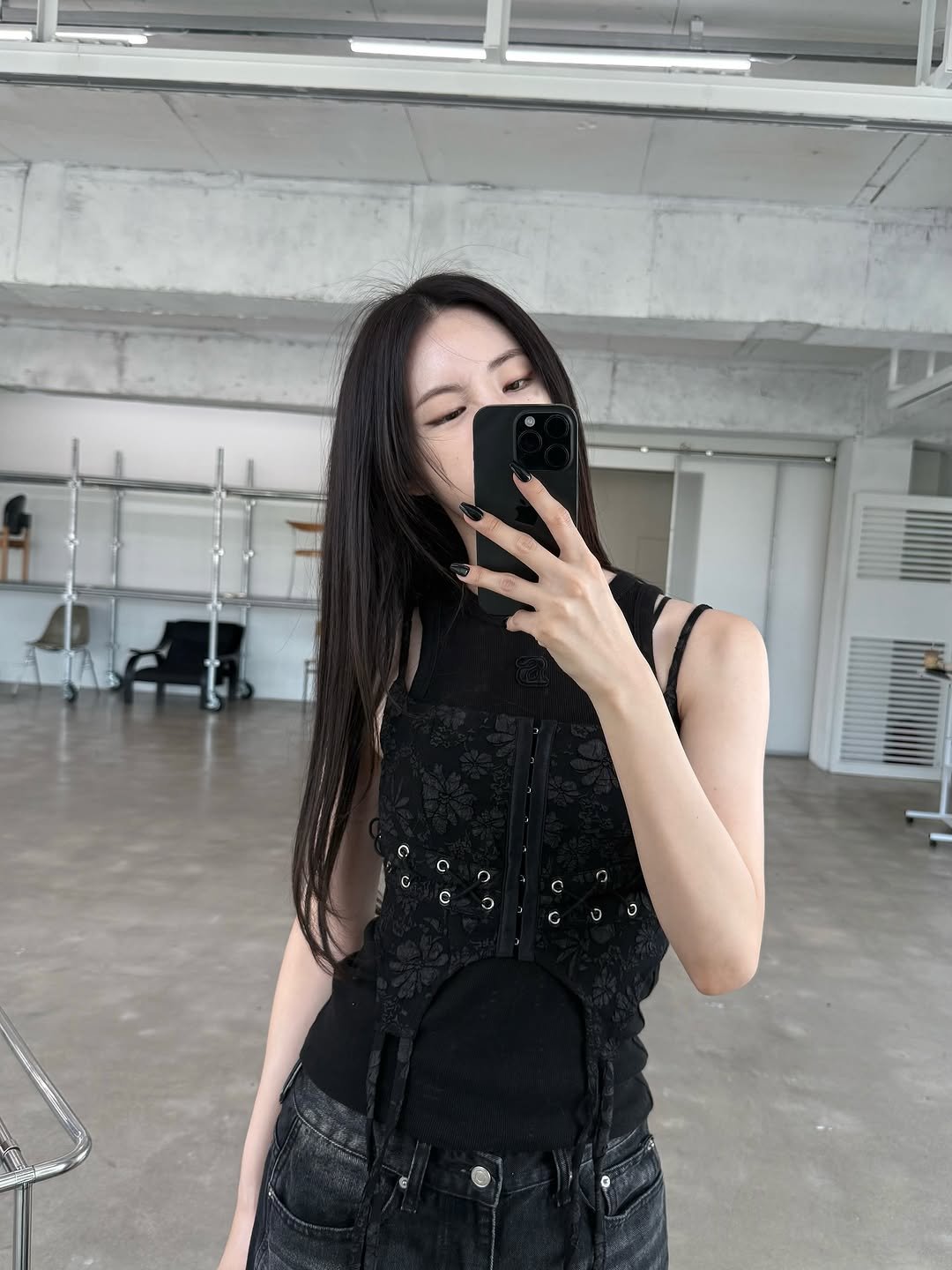 Photo by 신시아 on August 22, 2025. May be an image of 1 person, vest, top, dress and text.