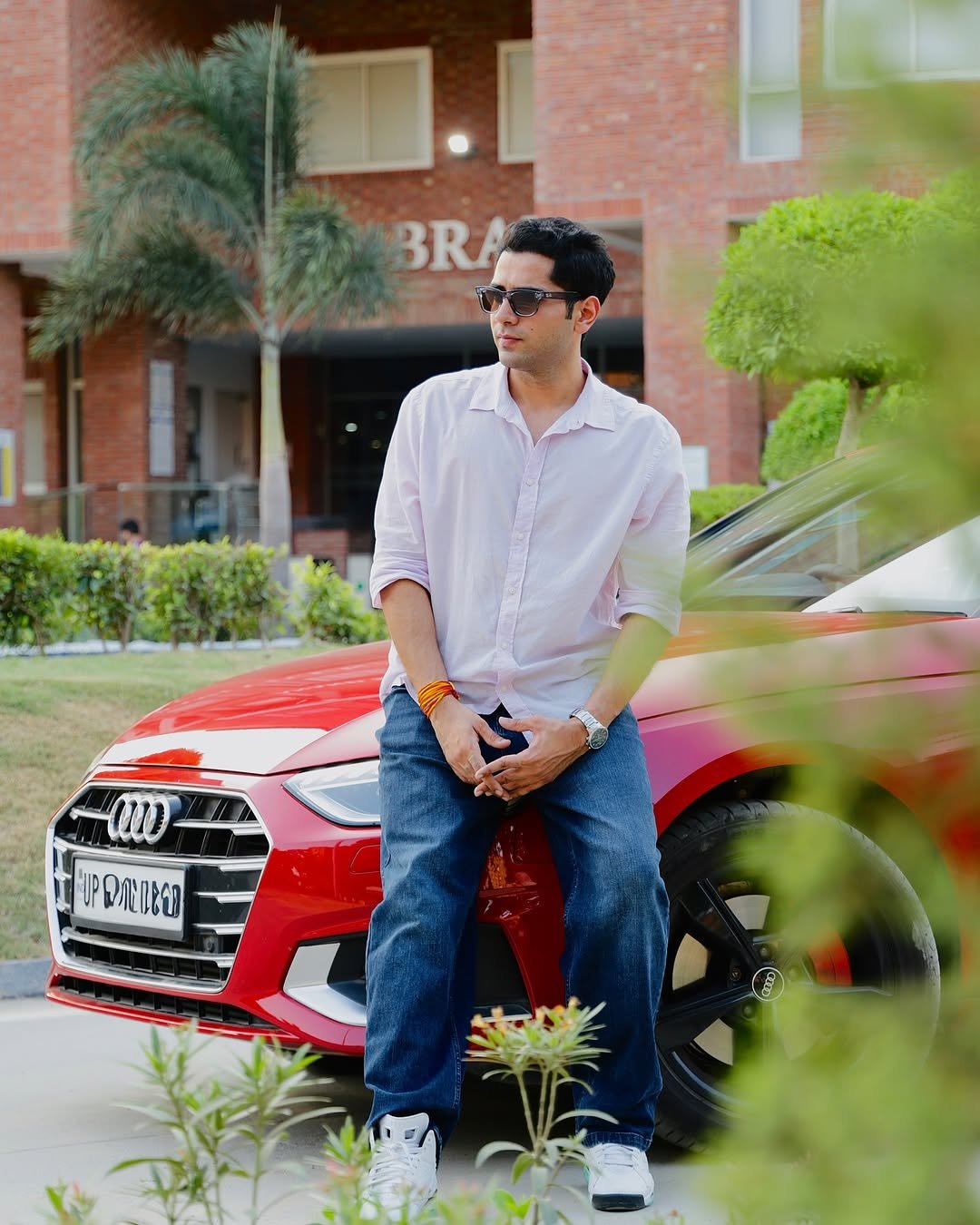 Photo by Shivam malik on July 06, 2025. May be an image of 1 person, beard, smiling, wrist watch, car, road and text.