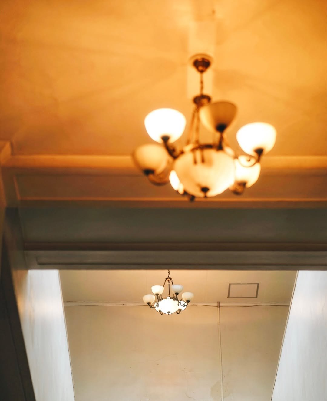 Photo by SHOTA 🟠🔵 on November 29, 2025. May be an image of lighting, candle holder, lightbulb, chandelier, hallway and text.