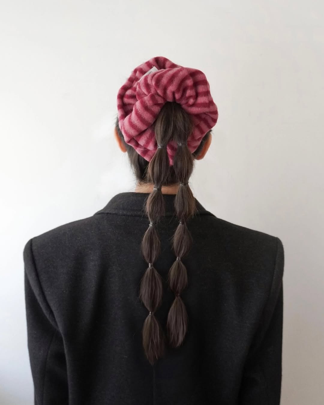Photo by COSYMOSY 코지모지 on November 24, 2025. May be an image of one or more people, braids, barrette and text.