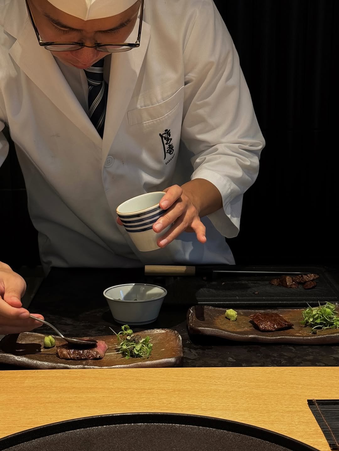 Photo by Siyoung on November 18, 2025. May be an image of sushi, sashimi, chopsticks, fillet and text.