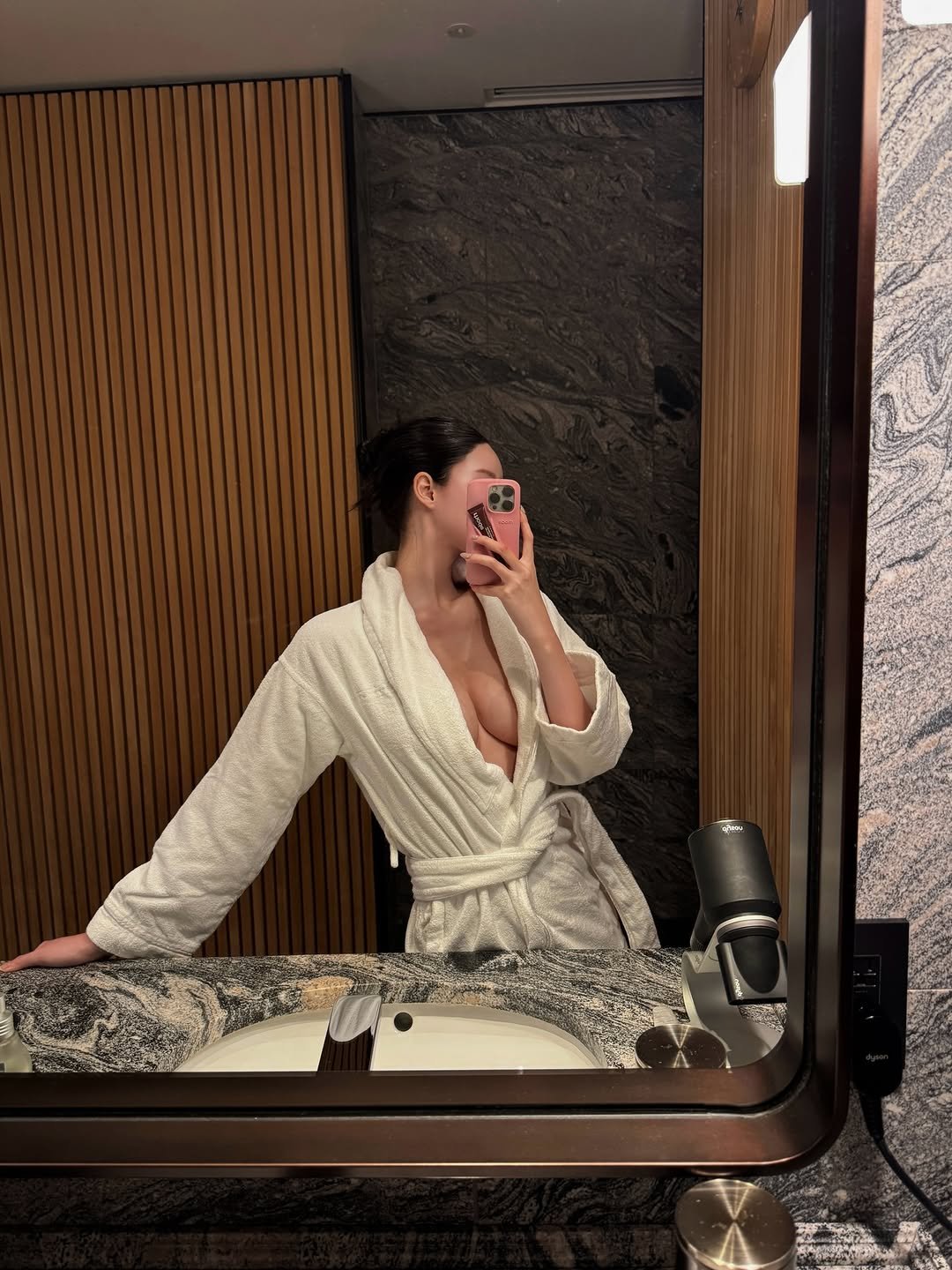 Photo by Siyoung on November 20, 2025. May be a selfie of mirror, bath robe, robe, shower and text.