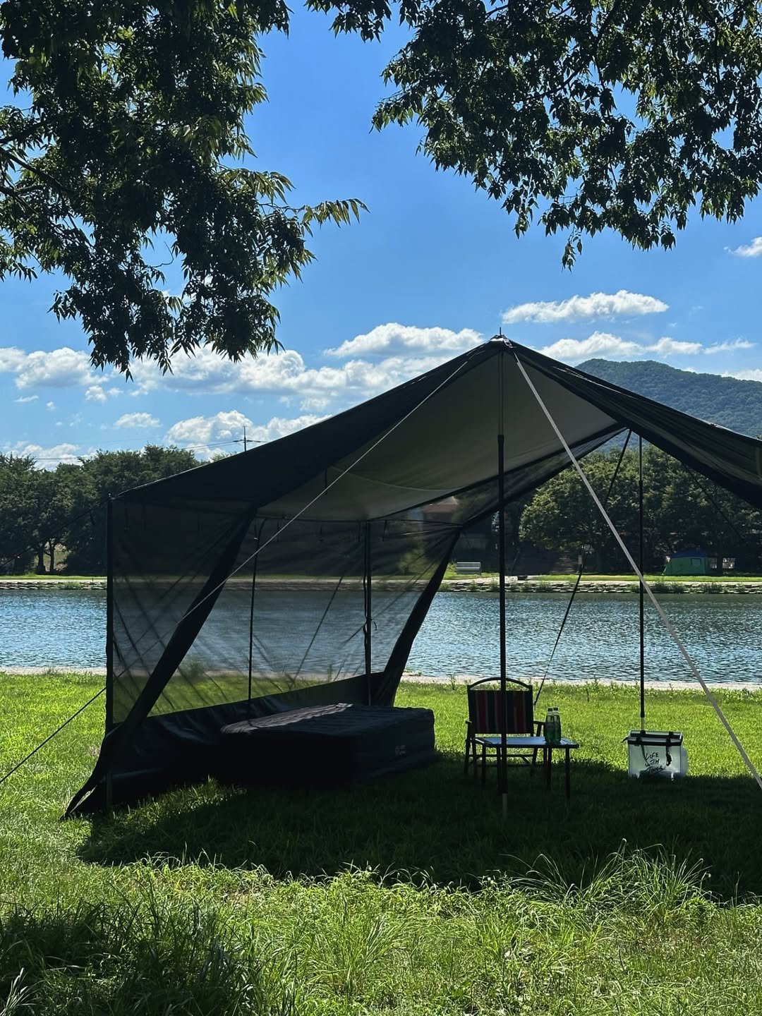 Photo shared by 🍃시기 캠프 on August 01, 2025 tagging @camvil__. May be an image of campsite, mosquito net, cabana, outdoors and text.