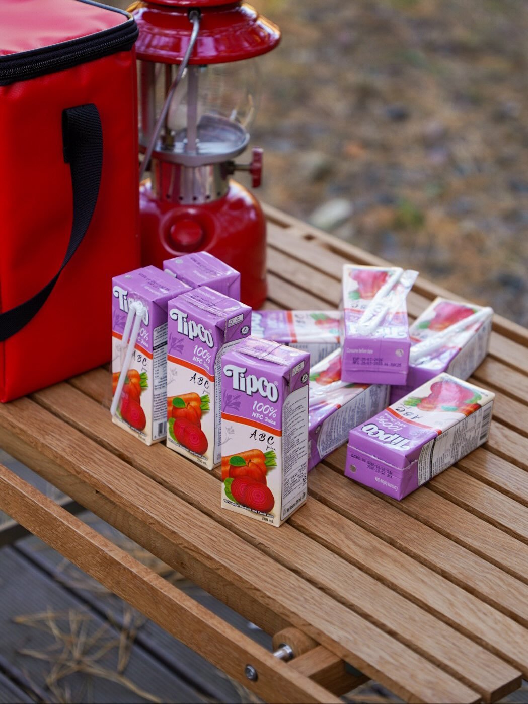 Photo shared by 🍃시기 캠프 on November 12, 2025 tagging @tipcojuice. May be an image of campsite, juice, lantern, outdoors and text.