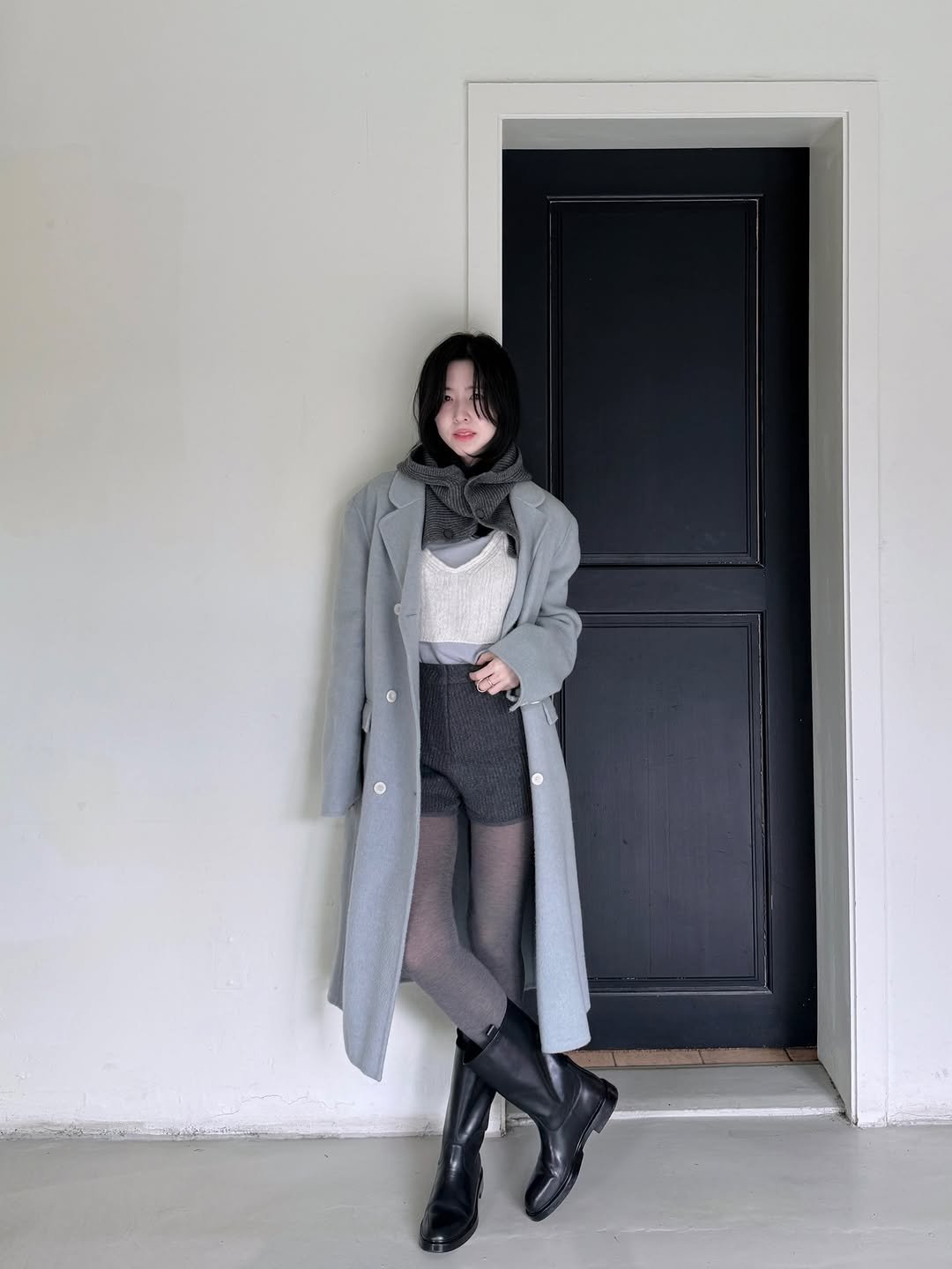 Photo shared by Eunbi Kim on December 17, 2025 tagging @hazzysaccessories, and @lfmall_official. May be an image of duffle coat, overcoat, tights, turtleneck, cardigan and text.
