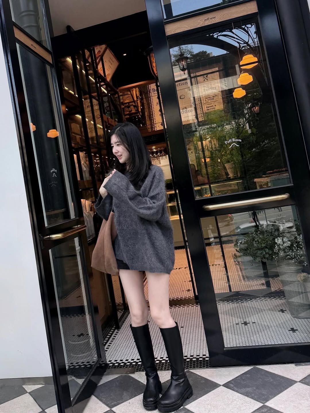 Photo by Eunbi Kim on September 25, 2025. May be an image of 1 person, duffle coat, overcoat, parka, cloak, turtleneck, boots, cardigan and text.