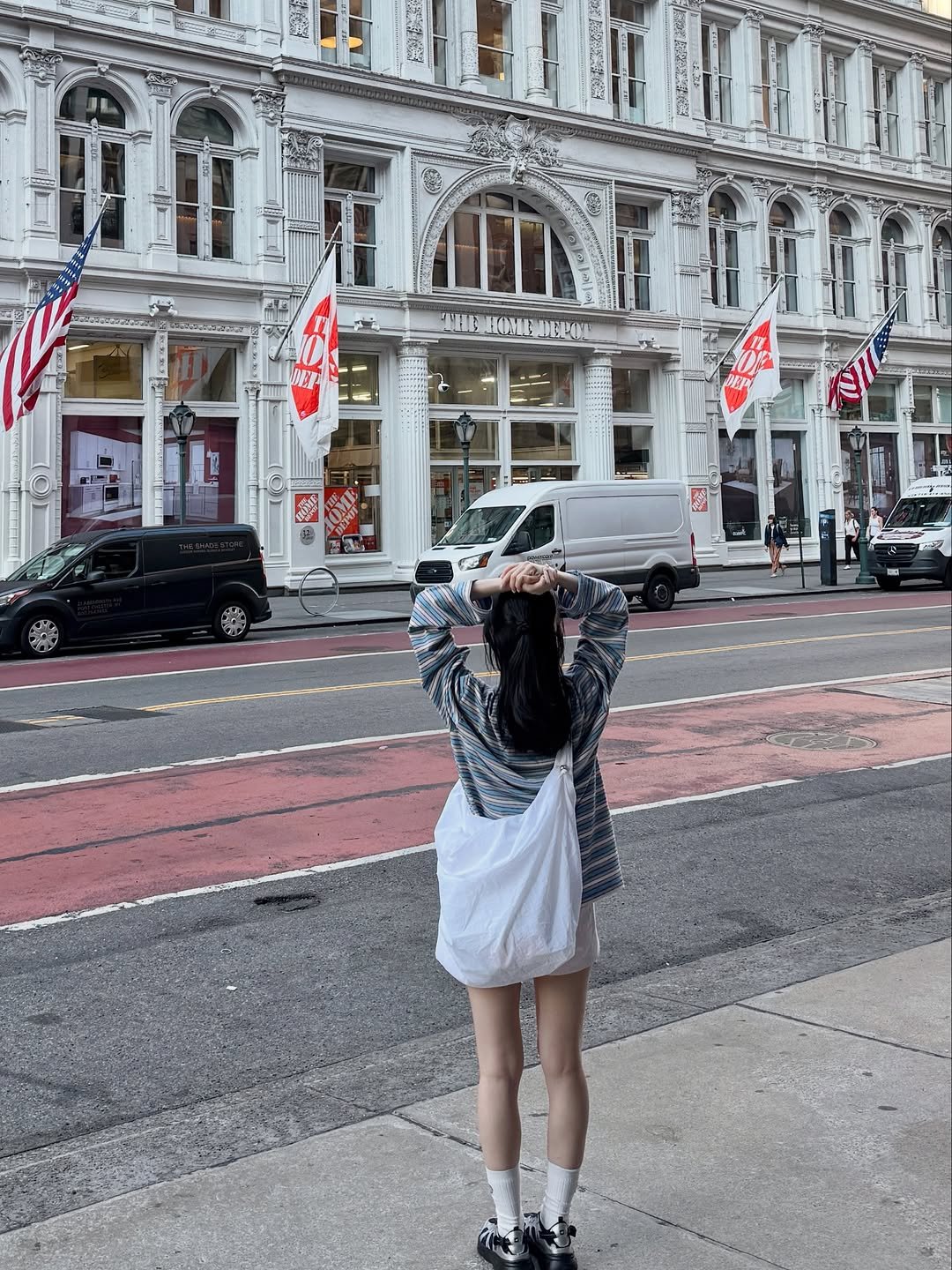Photo by Eunbi Kim on August 13, 2025. May be an image of 3 people, flag, street and text.