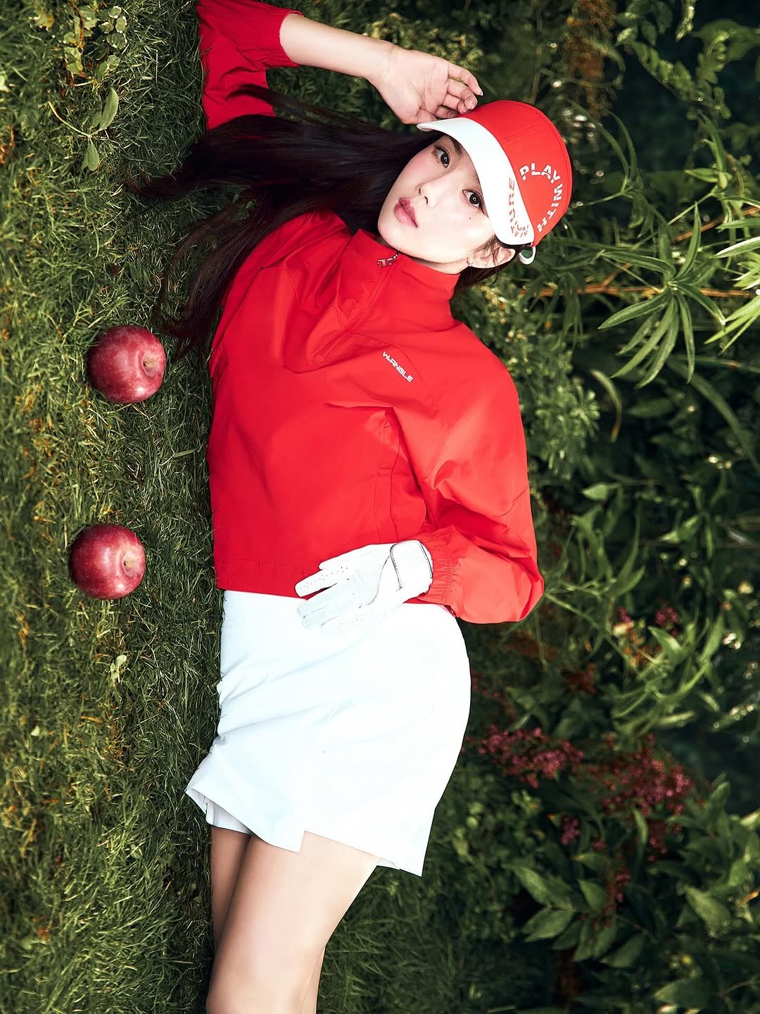 Photo shared by 권은비 on February 23, 2026 tagging @wide.angle. May be an image of one or more people, makeup, people golfing, hat, shorts, miniskirt, sportswear, racket, tree, outdoors and text.