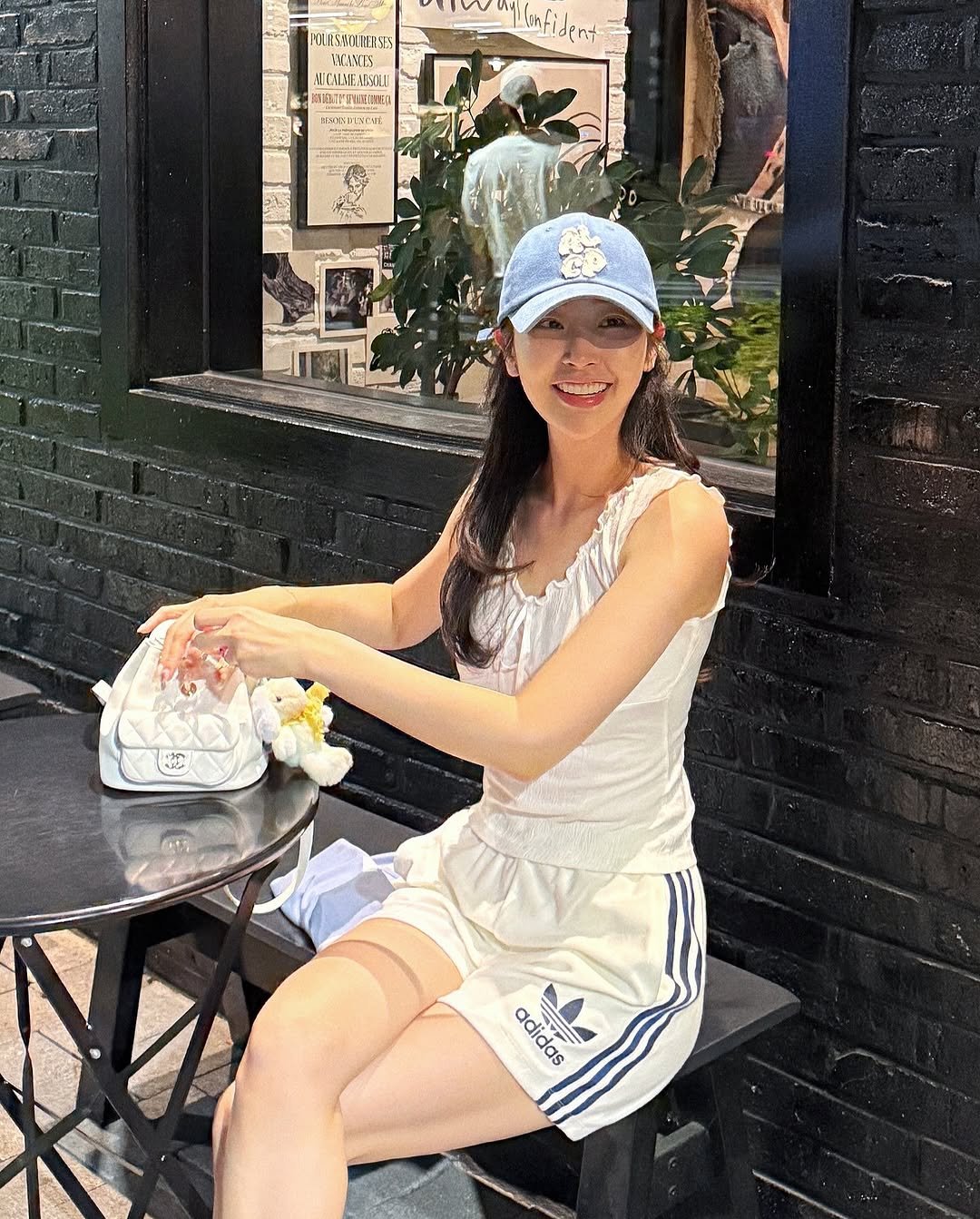 Photo by 심톨 𝐒𝐈𝐌𝐓𝐎𝐇𝐋 on August 28, 2025. May be an image of 1 person, hat, shorts, top and text.