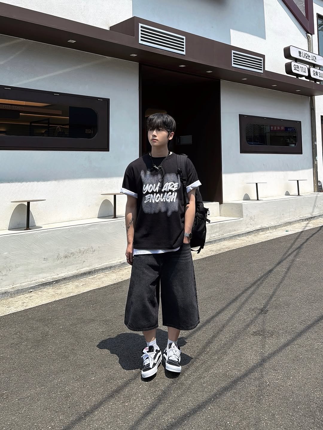 Photo by 신의현/에드앤마이너스 on June 24, 2025. May be an image of 1 person, street and text.