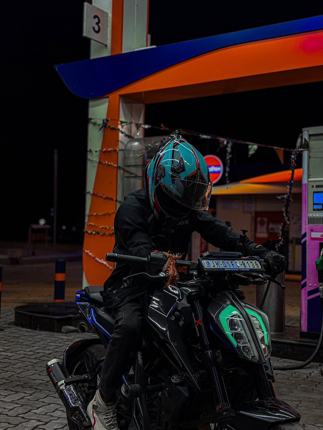 Photo by Vivek Kumar on September 30, 2025. May be an image of 1 person, racing a vehicle, motorcycle, helmet, scooter, face mask and text.