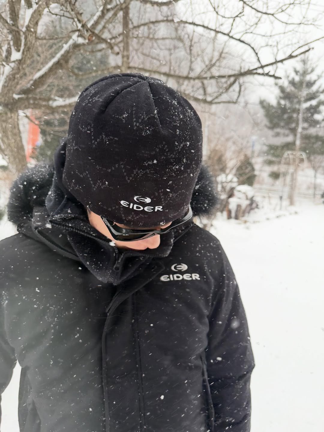 Photo shared by 남주혁 on January 13, 2026 tagging @eider.official. May be an image of snowball, hat, goosedown coat, face mask, fleece, snowsuit, parka, ski slope and snow.