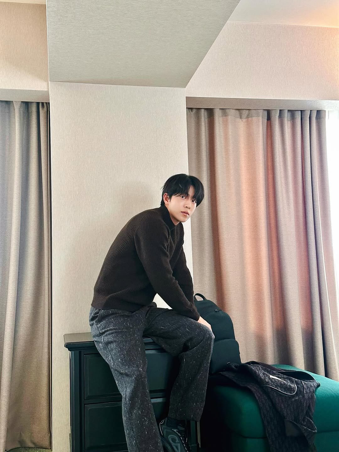 Photo shared by 남주혁 on September 19, 2025 tagging @dior. May be an image of 1 person, turtleneck, sweatpants and text.